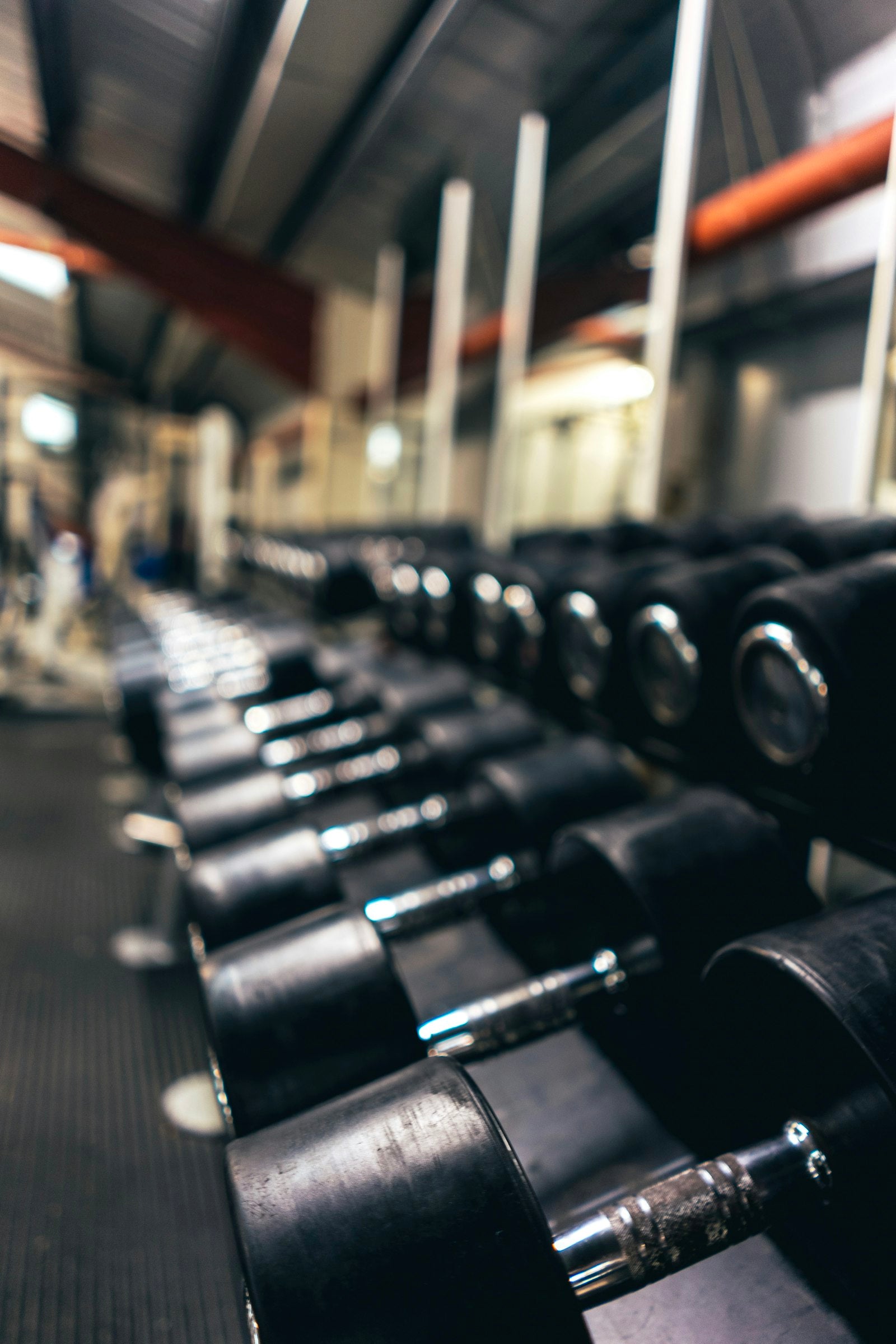 Sports & Fitness — rack of gym dumbbells