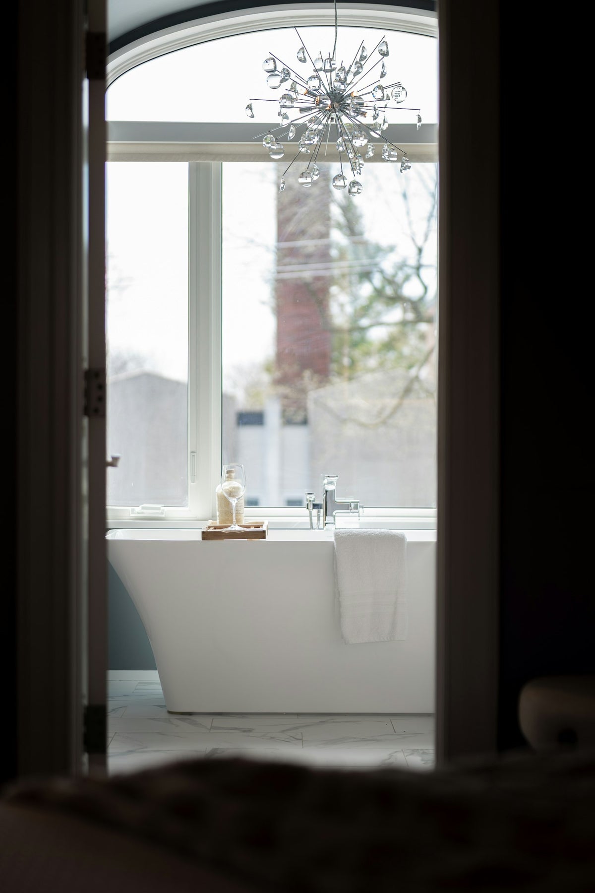 Bathroom — modern freestanding bathtub with a large window
